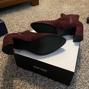 Burgundy suede boots.  Brand new. Never worn.  Excellent condition.